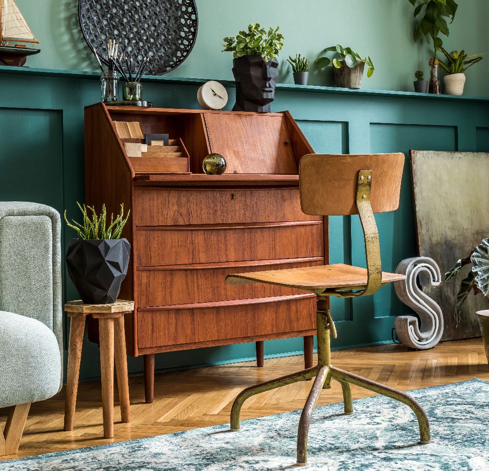 A bedroom where a wooden desk has become a focal point, reflecting an evolved style